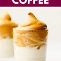 pinterest image of a glass with milk topped with whipped coffee