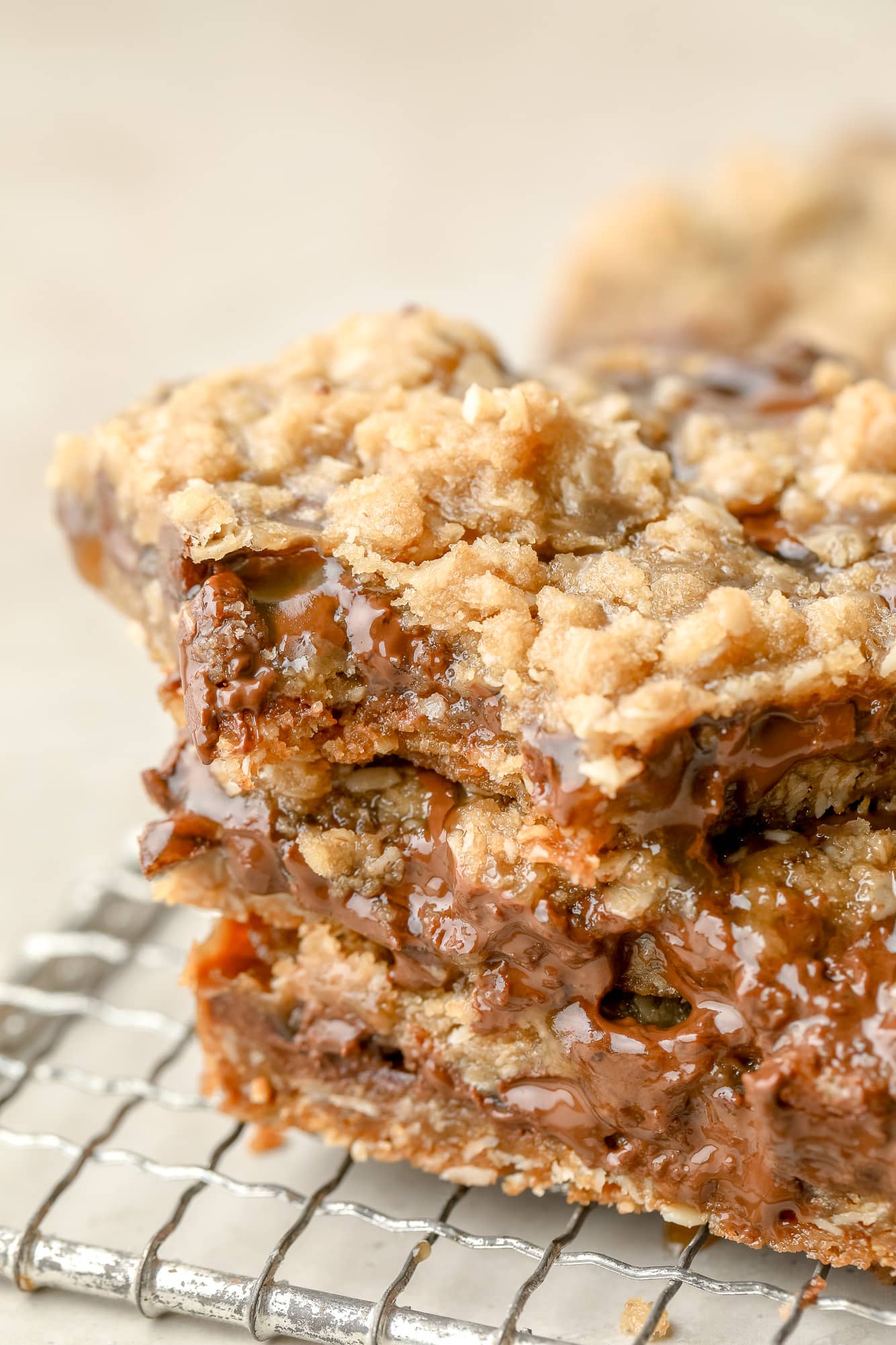 close up on a stack of 3 Vegan Carmelitas with a bite missing from one.