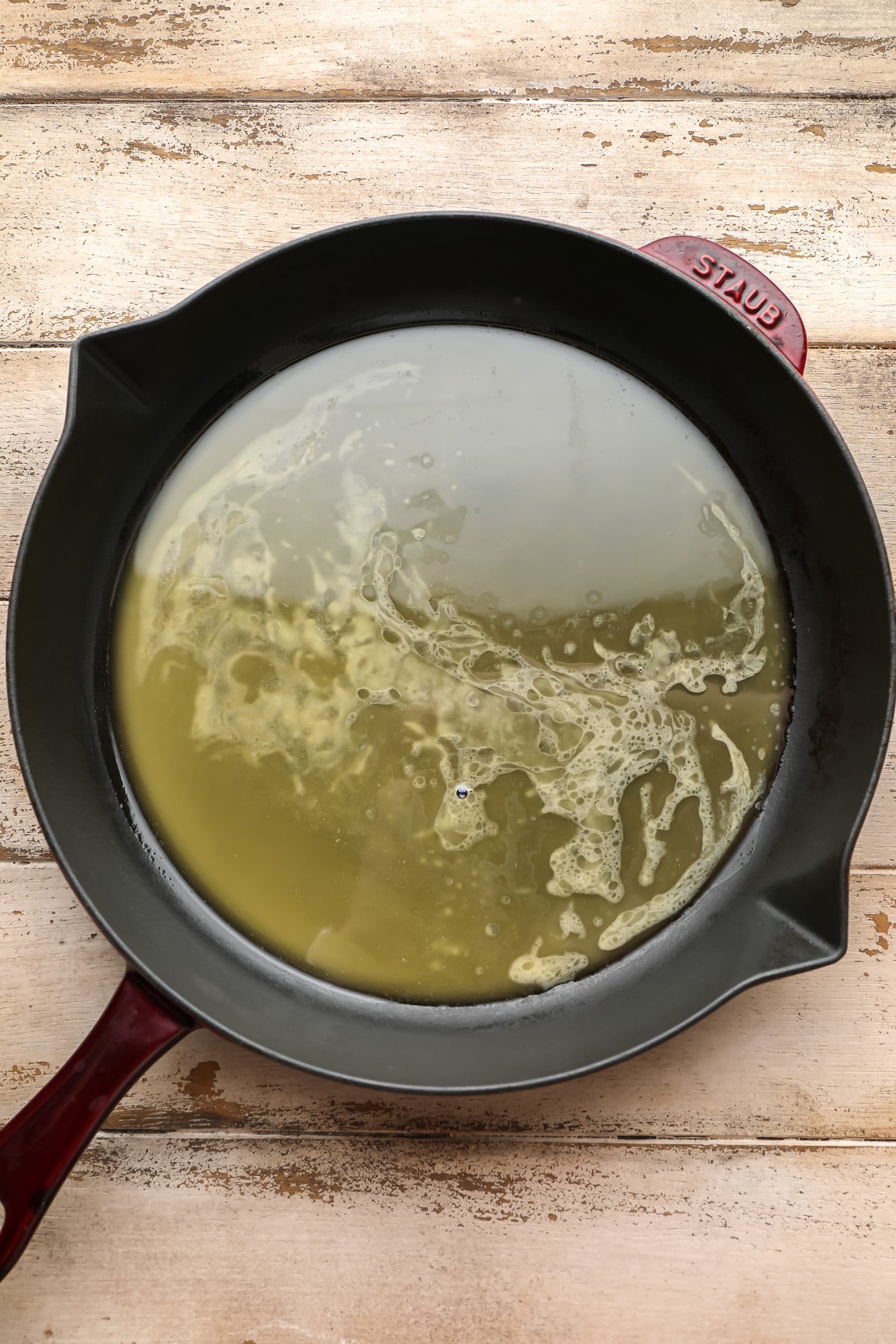 melted butter in a black skillet.