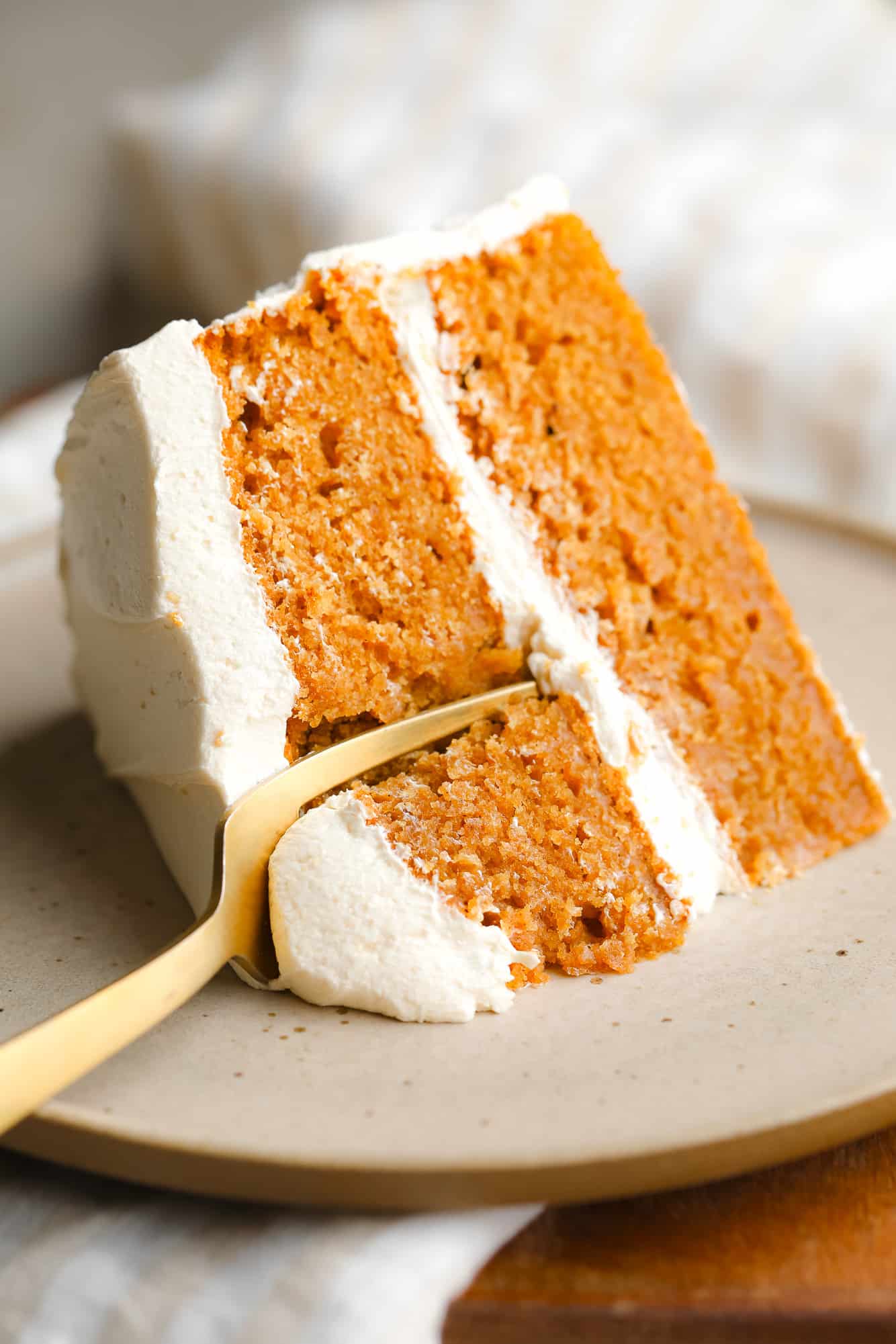 close up on a fork cutting into a slice of Pumpkin Spice Latte Cake.