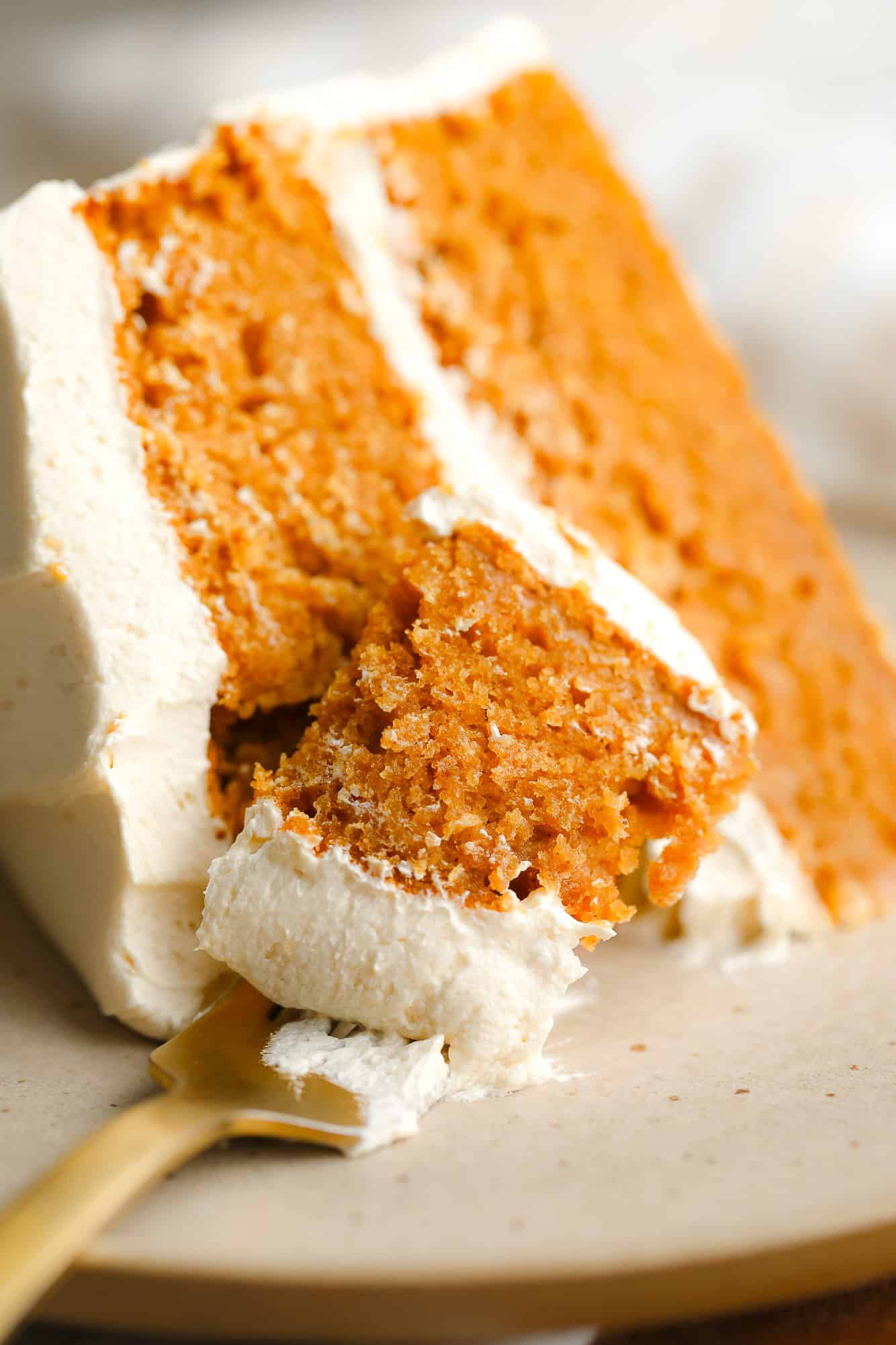 close up on a fork holding a bite of Pumpkin Spice Latte Cake.