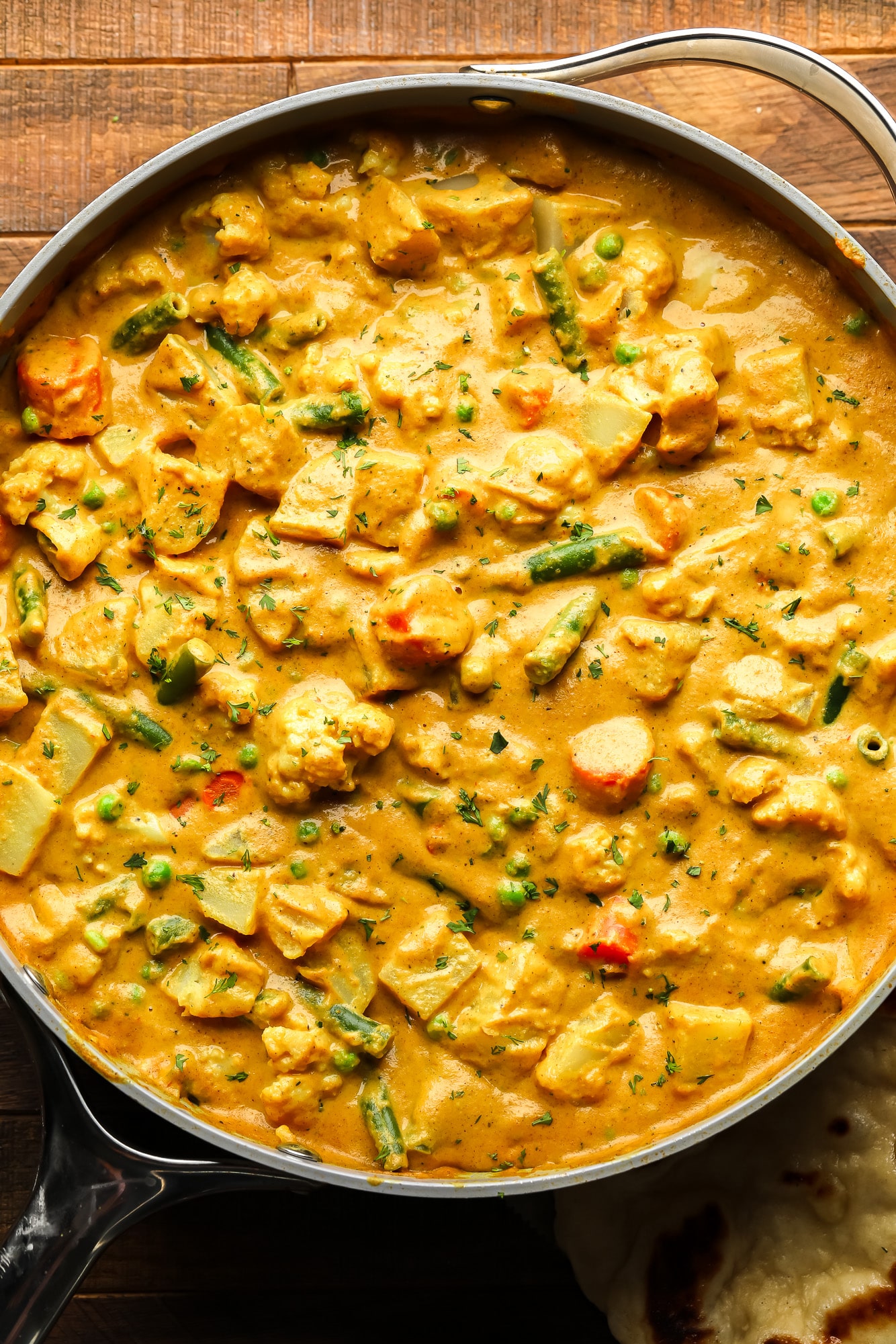 a large pot of golden vegetable korma.