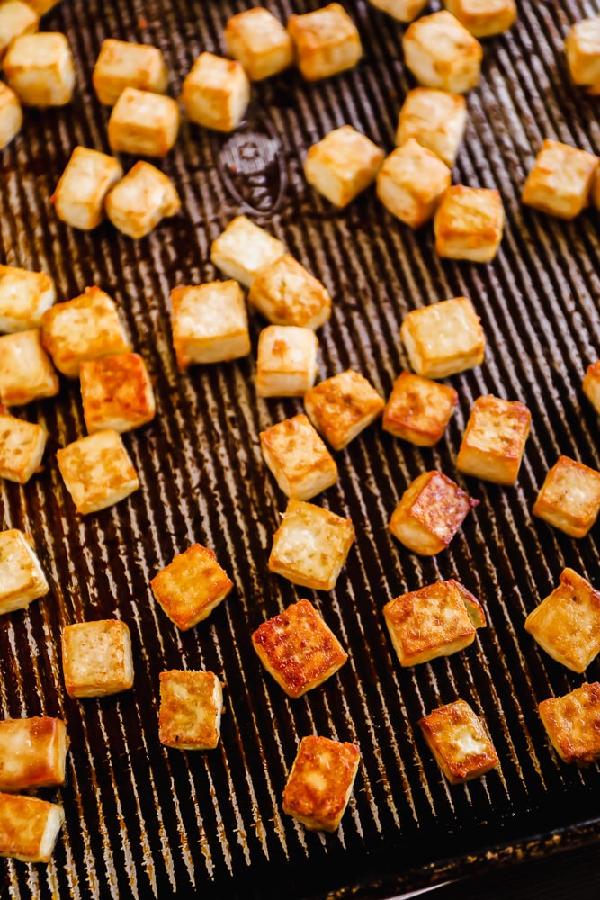 baked tofu cubes on a baking sheet.