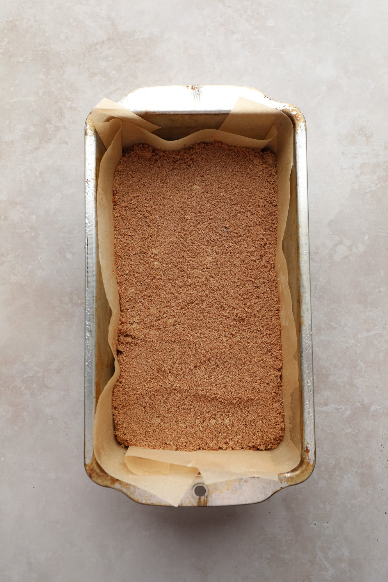 cinnamon sugar-topped quick bread batter in a loaf pan.