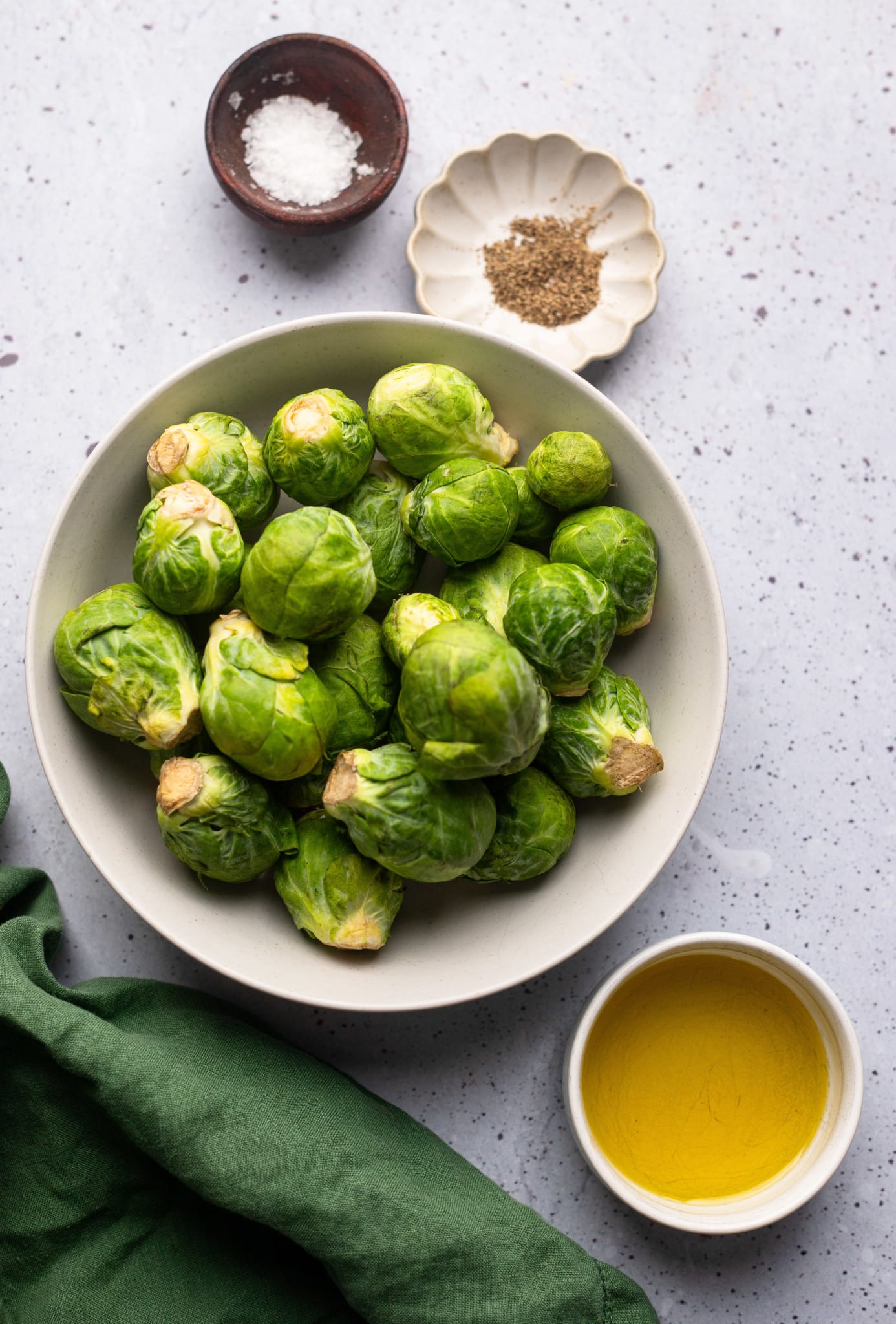 ingredients for air fryer brussels sprouts in individual bowls.