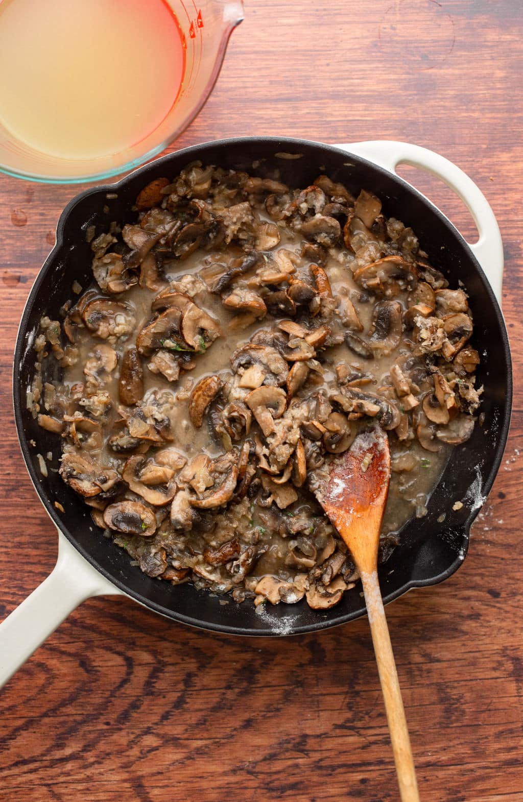 cooking mushrooms for mushroom gravy in a black skillet.