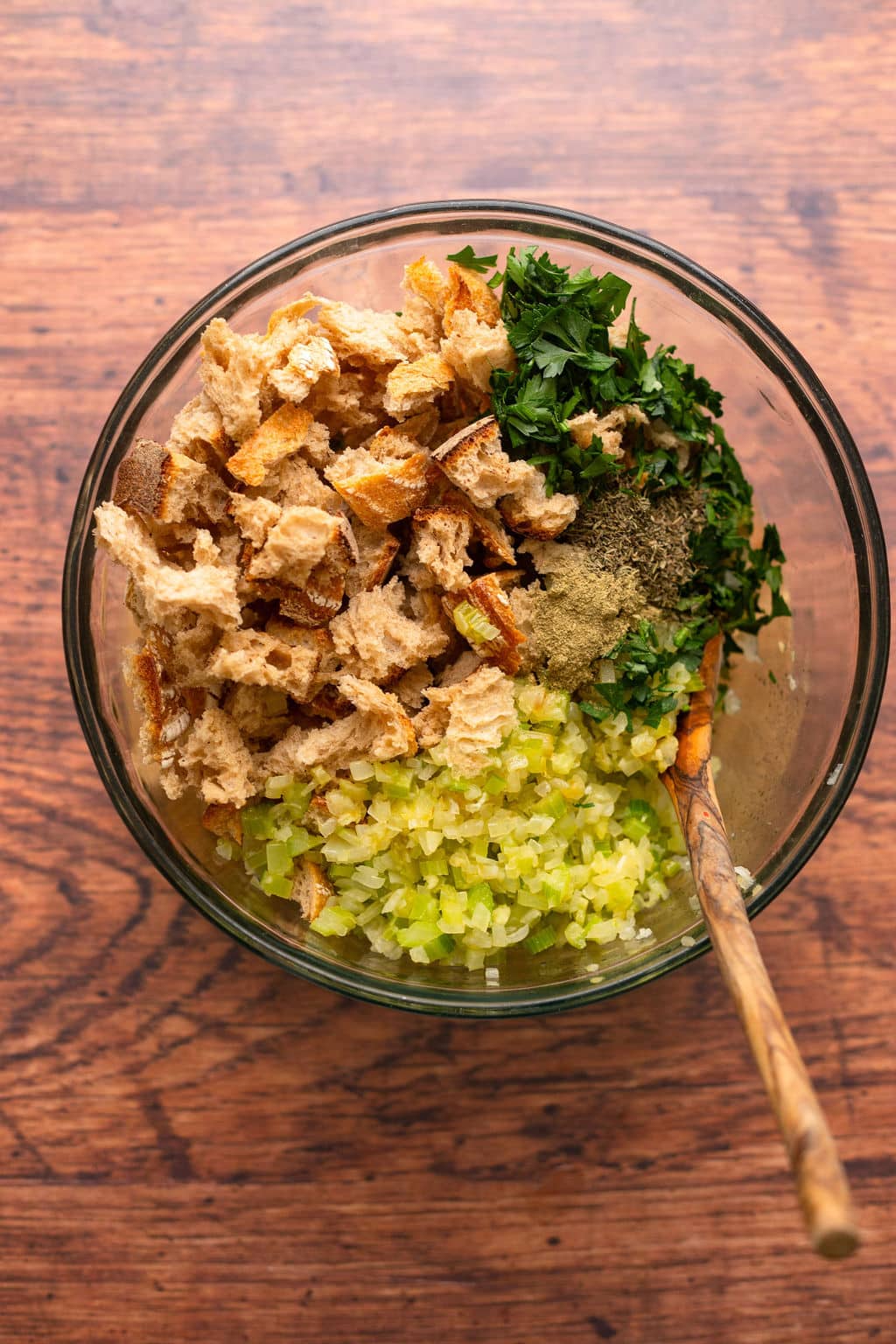 bowl with celery, parsley, bread cubes