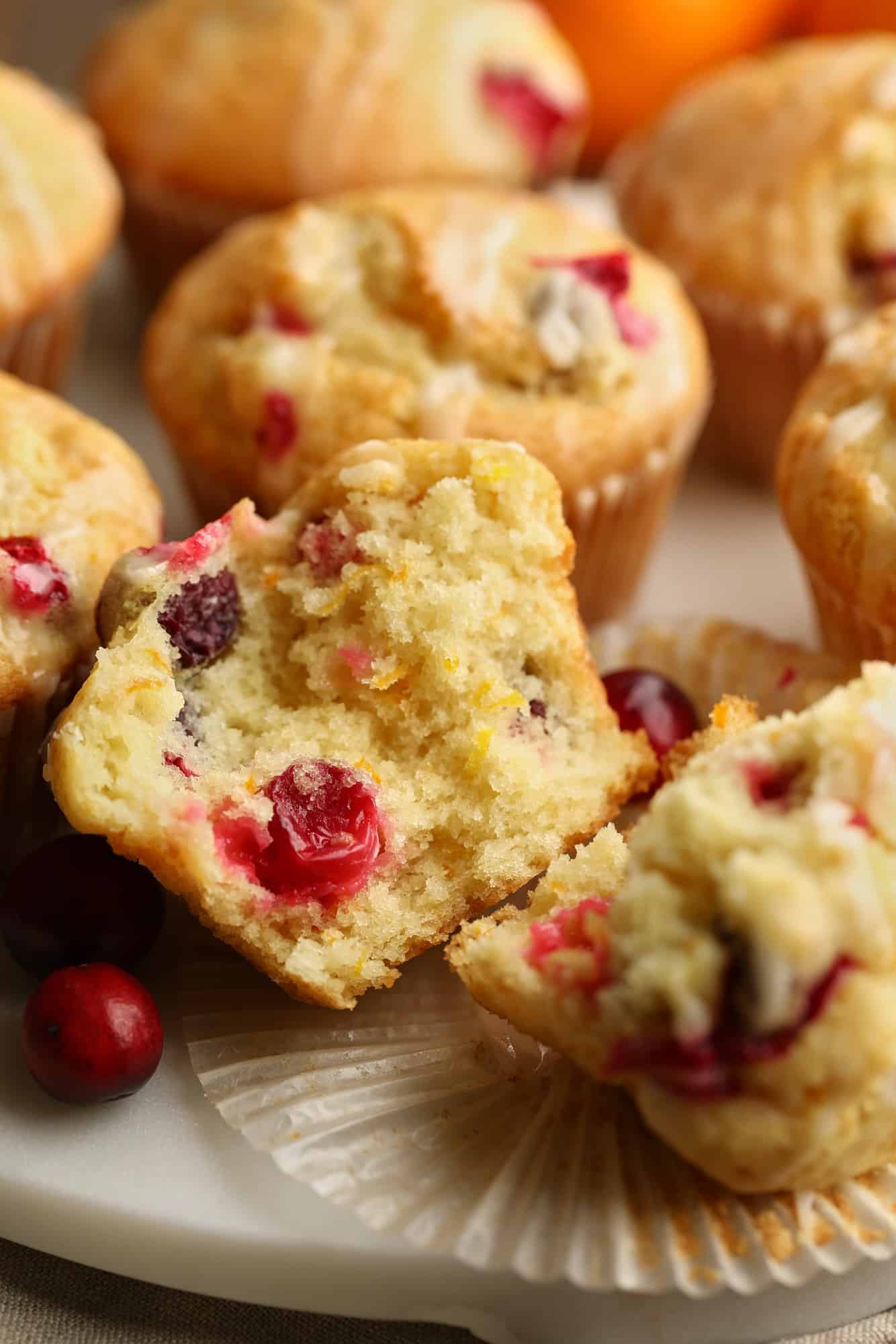 close up on a cranberry orange muffin cut in half.