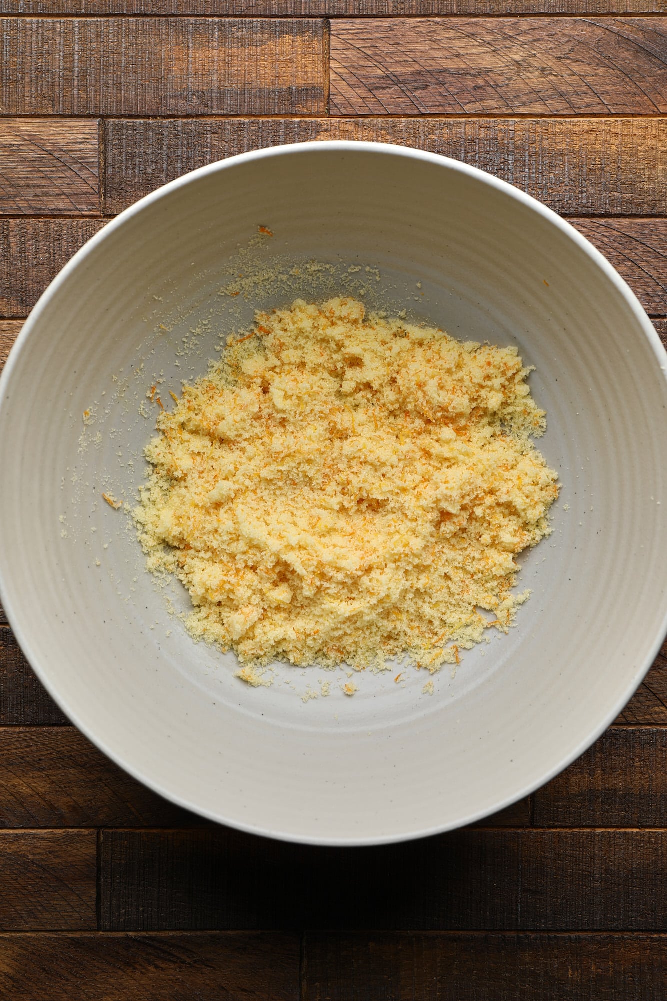 orange zest and sugar mixed together in a large bowl.