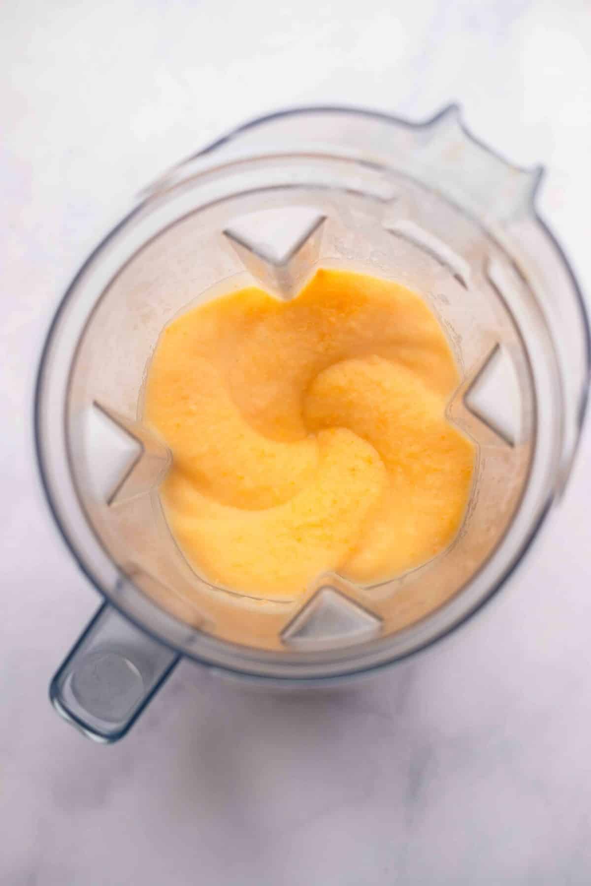 blender with creamy orange mixture