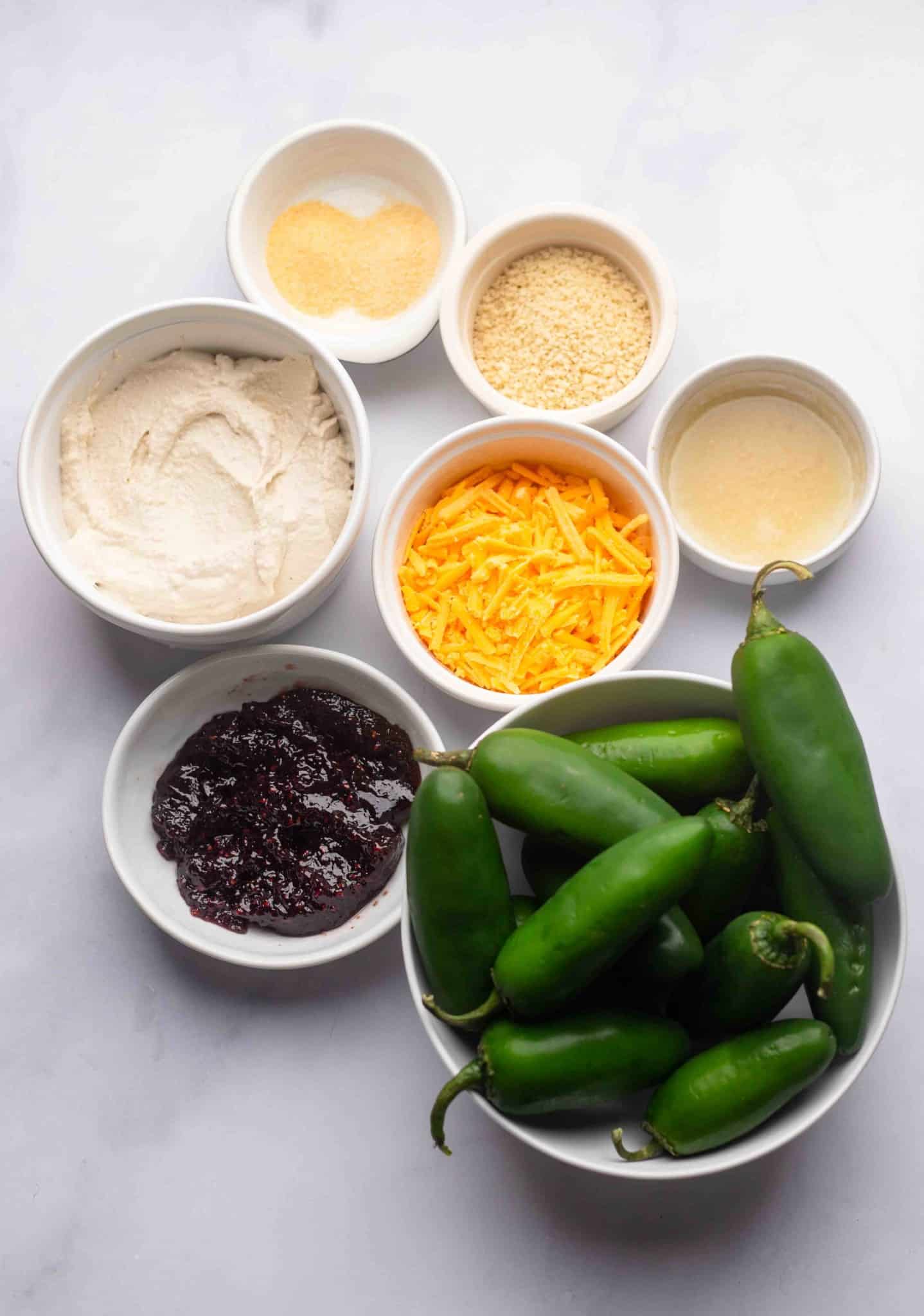 ingredients for Vegan Jalapeno Poppers in individual white bowls.