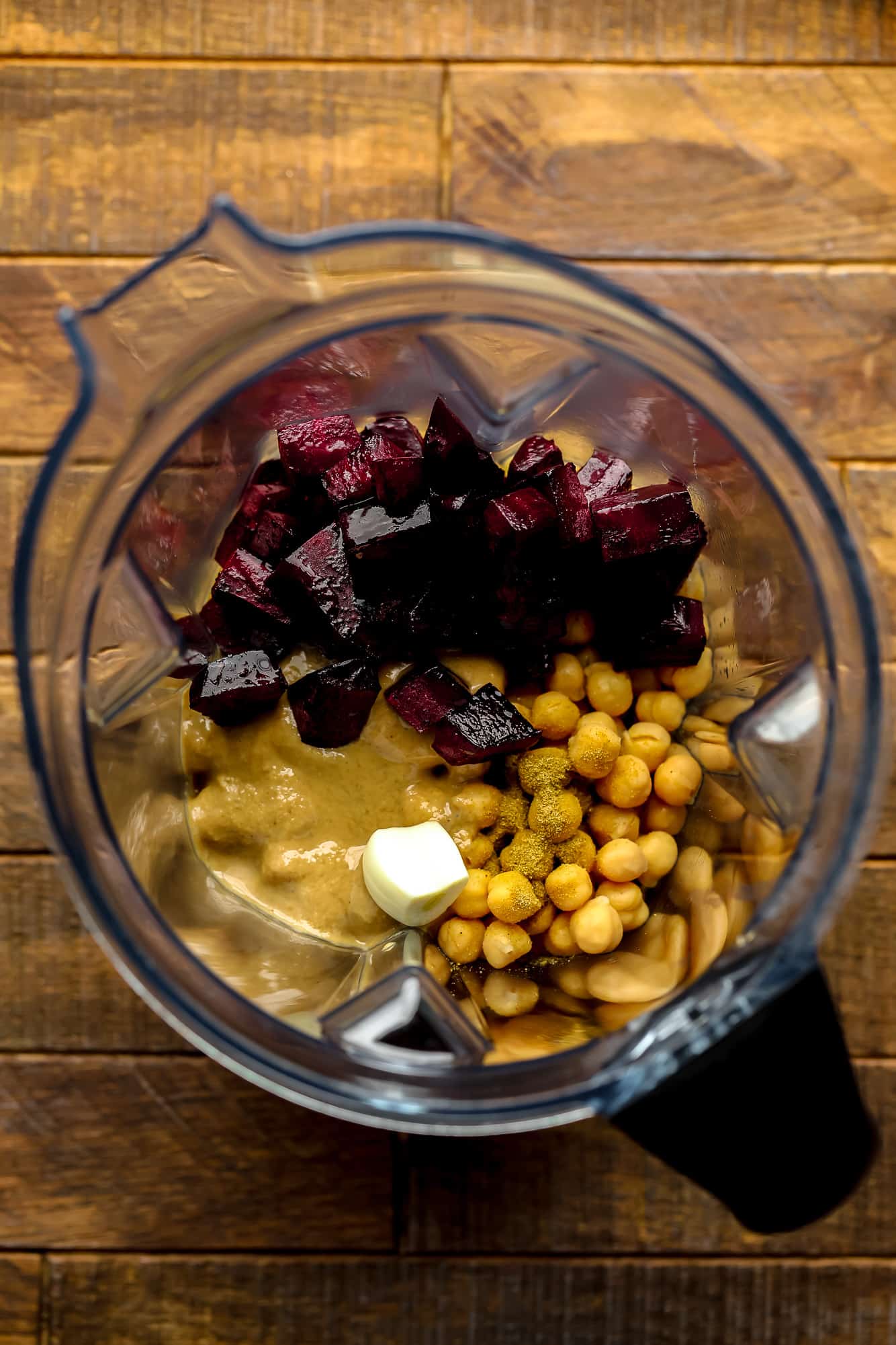 the ingredients for beet hummus in a blender.