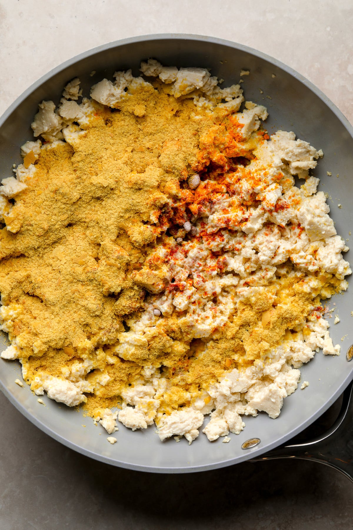 crumbled tofu covered in spices in a skillet.