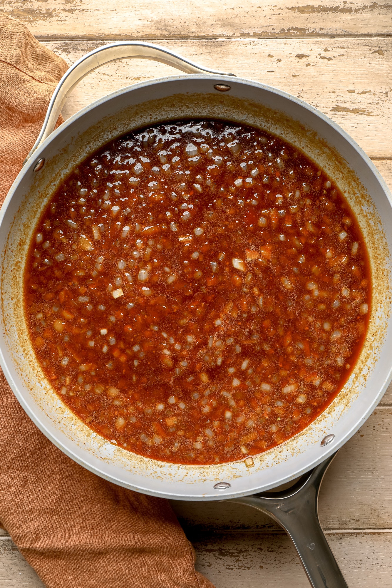 the red sauce for vegan baked beans in a skillet.