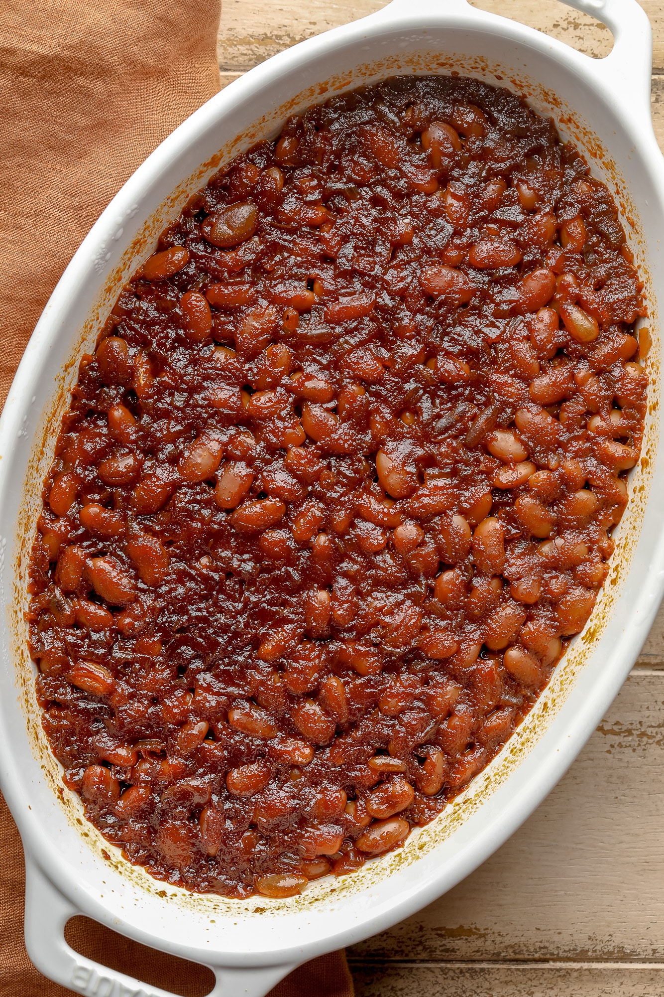 cooked vegan baked beans in a casserole dish.