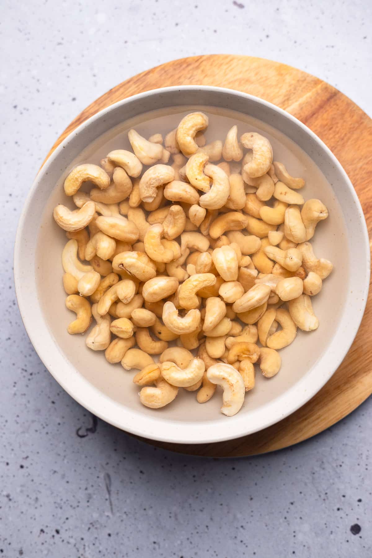 cashews and water in a bowl.