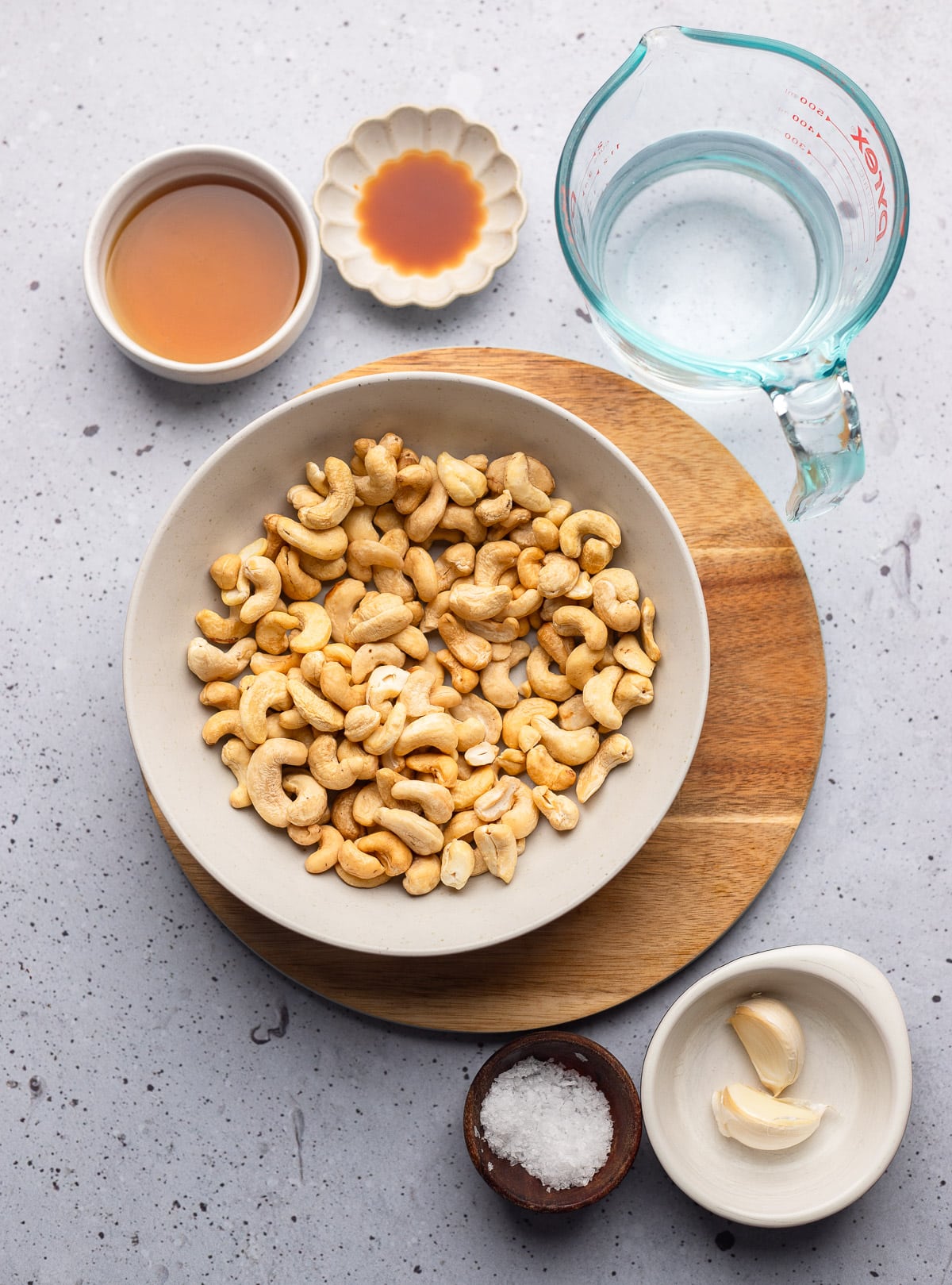 ingredients for cashew cream in individual bowls.